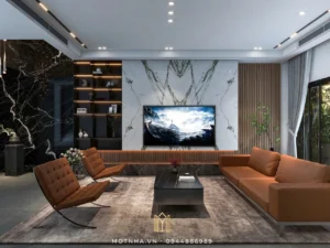 Phòng khách đẳng cấp là sự kết hợp tinh tế giữa các vật liệu tương phản, mang lại một không gian tiếp khách vừa sang trọng vừa ấm cúng.