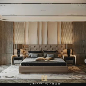 Phòng ngủ master được thiết kế theo phong cách hiện đại – luxury với điểm nhấn là đầu giường bọc nệm 3D kết hợp hệ vách ốp nan gỗ và da, mang lại cảm giác sang trọng và ấm cúng. Hệ đèn đầu giường tông đen đồng điệu với tổng thể giúp không gian thêm phần đẳng cấp.